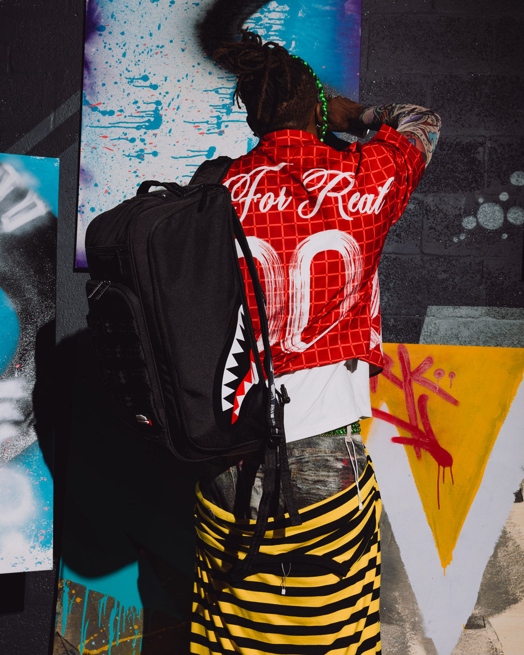 SPRAYGROUND® BACKPACK WYNWOOD WALLS COLLAB GRAFFITI UTILITY BACKPACK (8 CAN HOLDER)