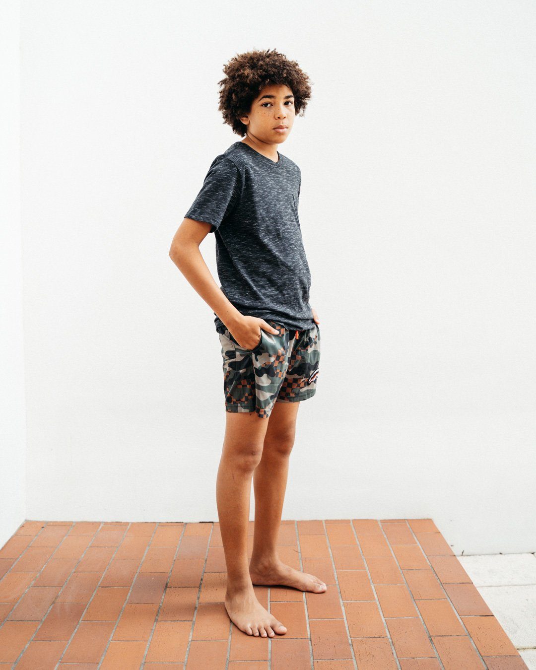 SPRAYGROUND® SWIM KIDS CAMO CHECKERED SWIM TRUNKS
