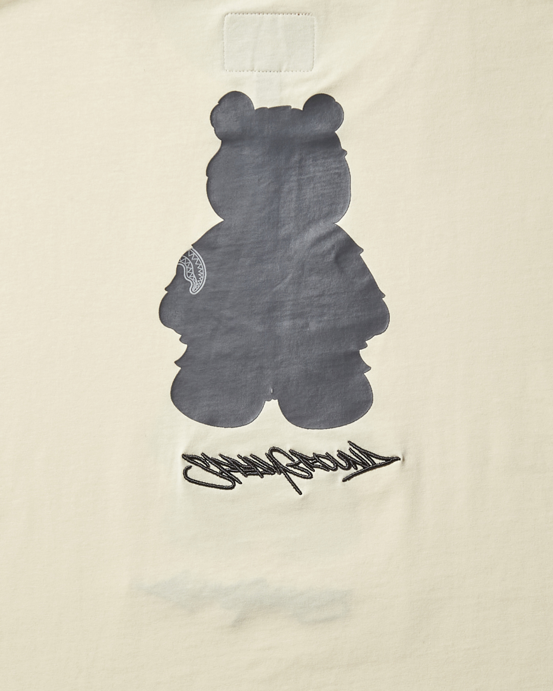 SPRAYGROUND® APPAREL SHORT SLEEVE GRAPHIC MONEY BEAR T-SHIRT (APRICOT)