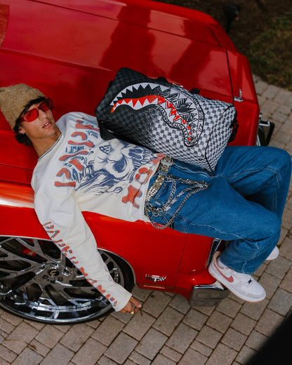 SPRAYGROUND® DUFFLE SCRIBBLE DRIBBLE CHECK DUFFLE