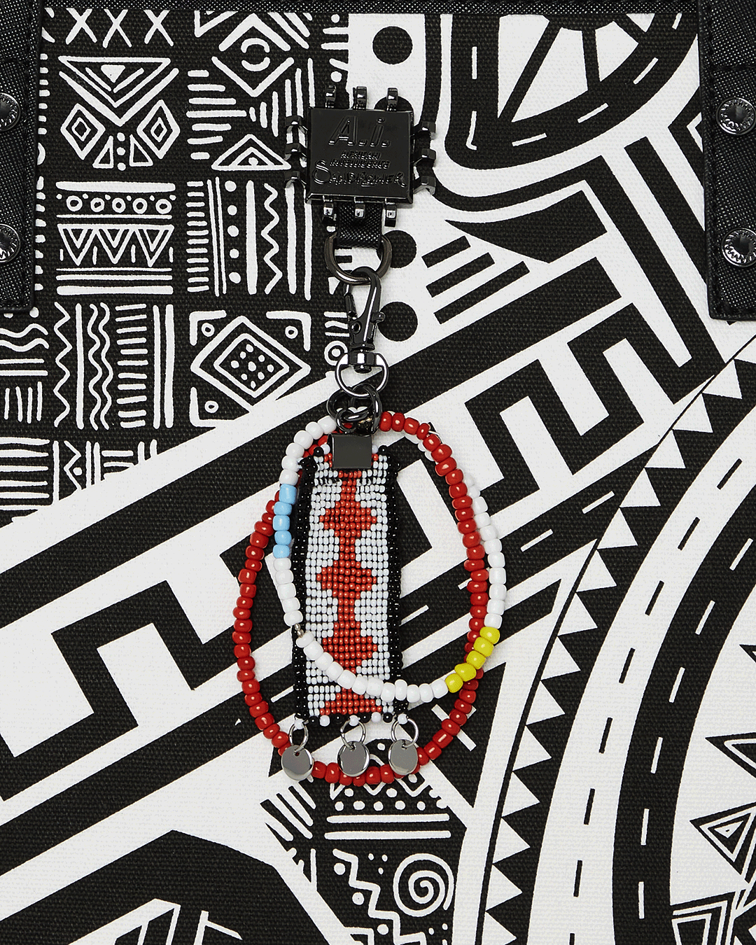 SPRAYGROUND® TOTE A.I. AFRICAN INTELLIGENCE THE SKYHAWK WING TOTE - SANDFLOWER COLLAB