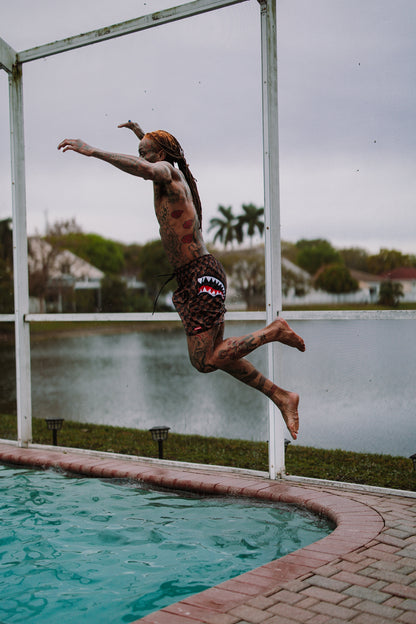 SPRAYGROUND® SWIM PEEKING CHARACTER CHECK SWIM SHORTS