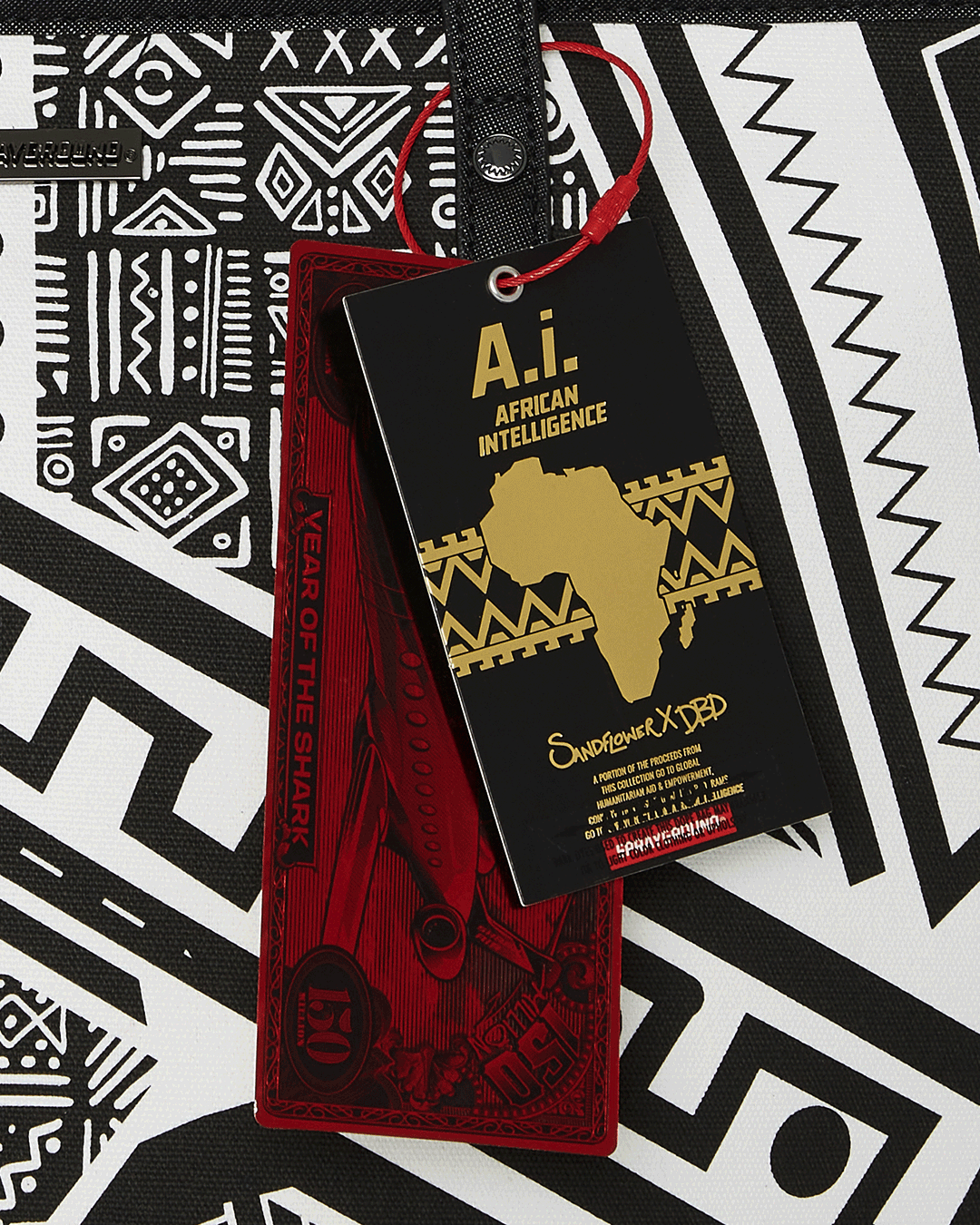 SPRAYGROUND® TOTE A.I. AFRICAN INTELLIGENCE THE SKYHAWK WING TOTE - SANDFLOWER COLLAB